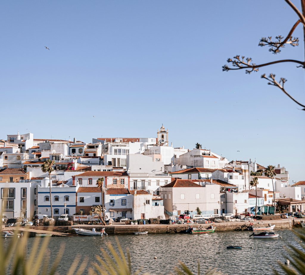 white washed houses with cliff views by the coast of Algarve Portugal