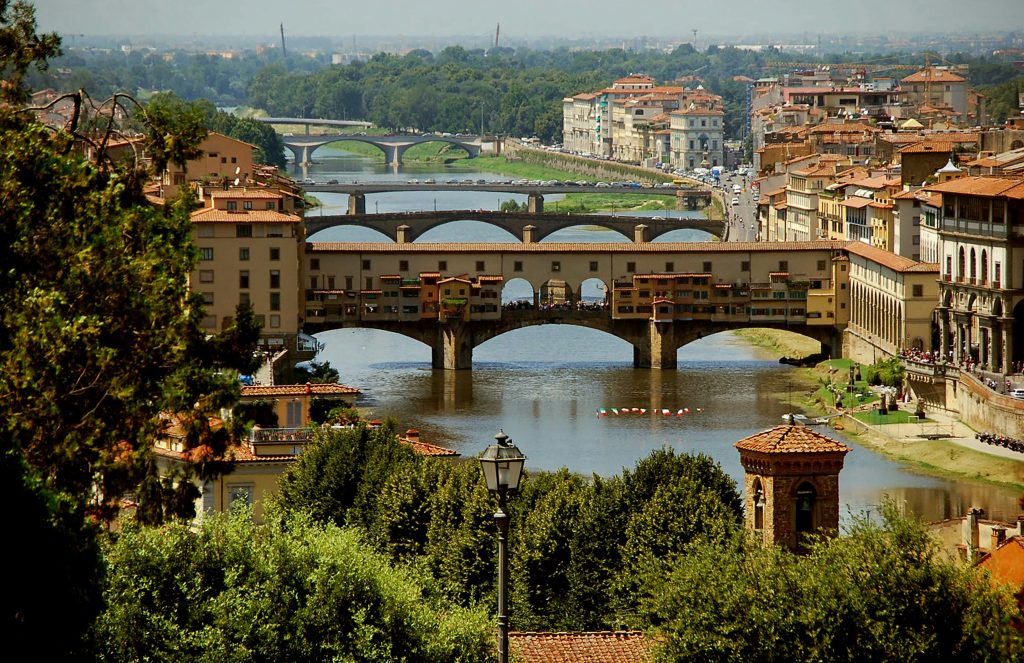 City walks over the bridge in Florence Italy